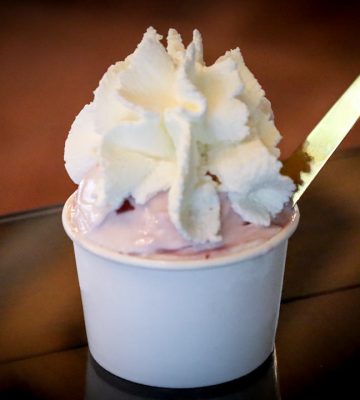 Sour-cherry yogurt gelato topped with whipped cream. Villaggio Colafrancesco